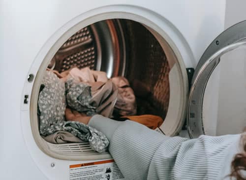 Why does my washing machine smell even after cleaning?